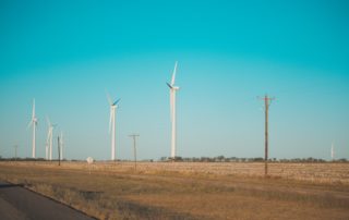 Wind farm against blue sky: AEMO say renewable energy transition happening faster than predicted