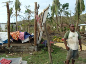 A home destroyed by a cyclone, Fiji.