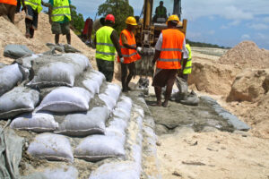 Workers building seawalls on Kiribati beach