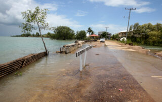 High sea tide floods road on Sabai Island, Torres Strait,